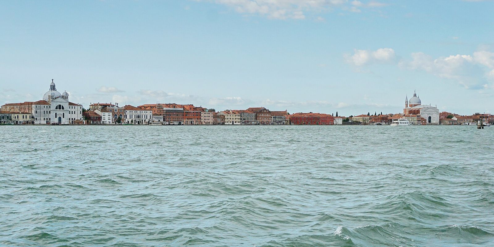 The Giudecca waterfront across the Giudecca Canal, with the Redentore on the right