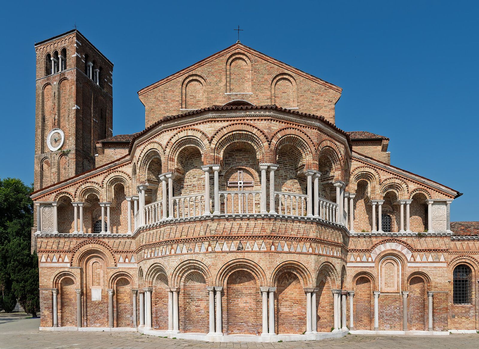 The arcaded brick apse of the Basilica dei Santi Maria e Donato on Murano, with its bell tower on the left